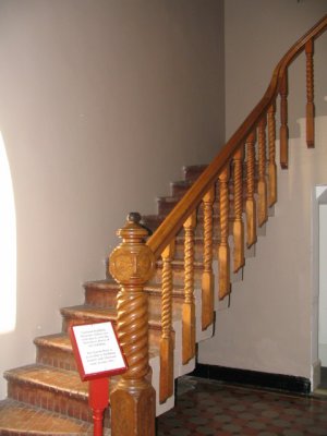 Back staircase turned newel post and baluster.jpg