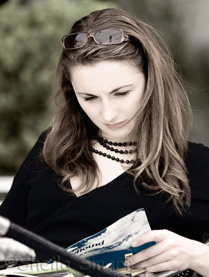 Young woman reading at Quay