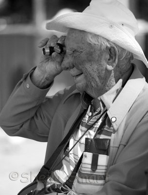 Elderly man with telescope