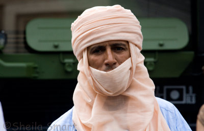 Man in arab dress at Bastille Day parade