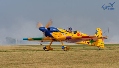 Yellow Stunt Plane on Taxiway