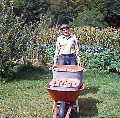 Grandpa with a portion of the harvest (Scanned from old photo)