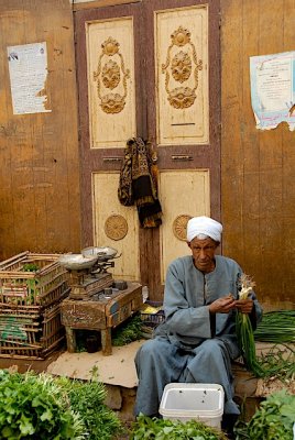 Selling vegetables in Aswan market.