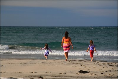 Mother and daughters enjoying the beach.jpg