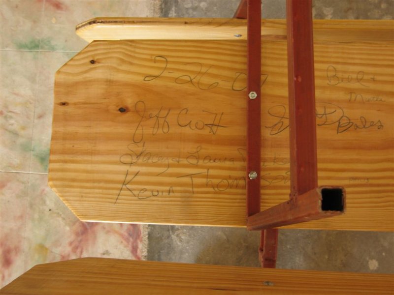 we signed the bottom of a pew before putting it together