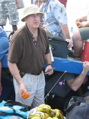 John handing out fruit for us to eat while on the boat