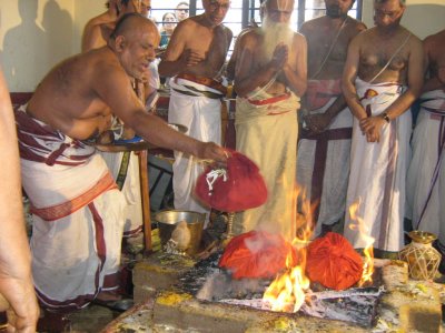 Srikaryam Swami submitting Poorna Ahuthi in Homam