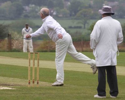 There he goes.....in a flash...........can't even wait til he gets to the crease: he's that keen.