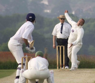 ....avoids the umpire with re-modelled pensioner's round arm hat lifter