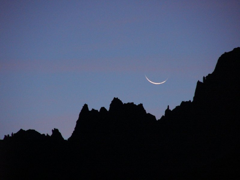 Crescent moon rising over the French Alps