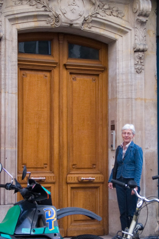 Susan at the door of 11 Rue Lacpde