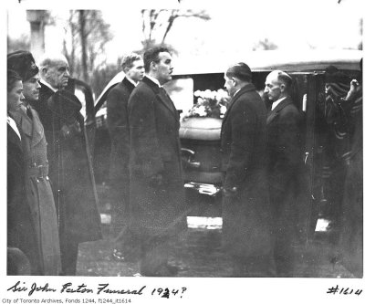 I DOUBT THAT THE EATON FUNERAL, IS AS SUGGESTED.

(SIR JOHN EATON'S FUNERAL.)

1) MID, TO LATE '30s.

2) CLOTH COVERED COFFIN.

3) SERVICE NOT AT THE TIMOTHY EATON CHURCH.

4) LADY EATON/JOHN JR NOT TO BE SEEN.

NOTE: OF THE TWO MEN FACING EACH OTHER, WILLIAM (BILL) MILES

IS ON THE LEFT (ALFRED ROGERS BEHIND HIM) AND MILES' OWN

COACH DRIVER IS ON THE RIGHT.