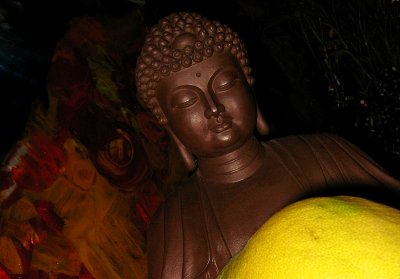Shelf Buddha contemplating fruit