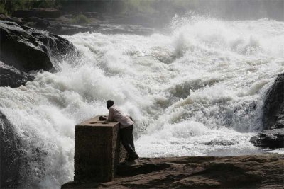 Musa, our driver, contemplates Murchison Falls