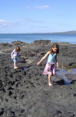 Hannah and Molly on the rocks at Takapuna