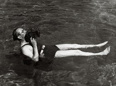 Martin Munkacsi, photographing for Harper's Bazaar in Long Island, taking an angle shot of a diver, 1935