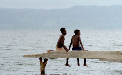 Two kids on a log Lake Bosomtwi