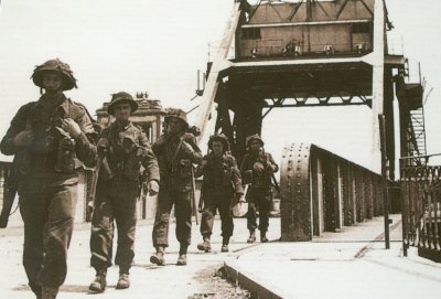 Photograph of soldiers crossing the bridge