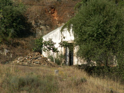 houses lie scattered over the hillsides