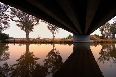 river reflections under the bridge