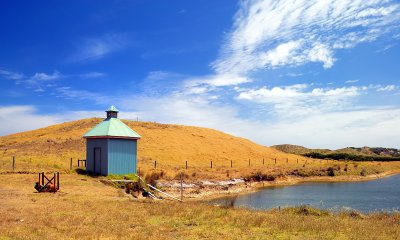 blue hut by the dam