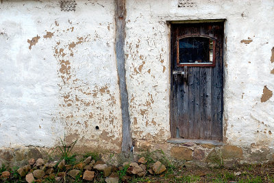 Old door and flaking walls ~
