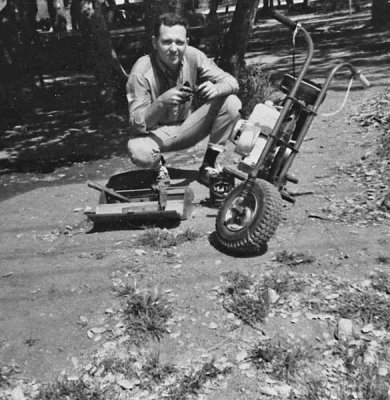 Dad working on the minibike, Apr 1970