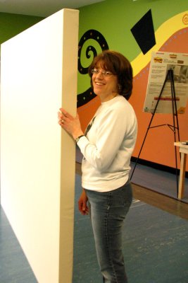 Is Sue holding the frame up, or is it the other way around?
