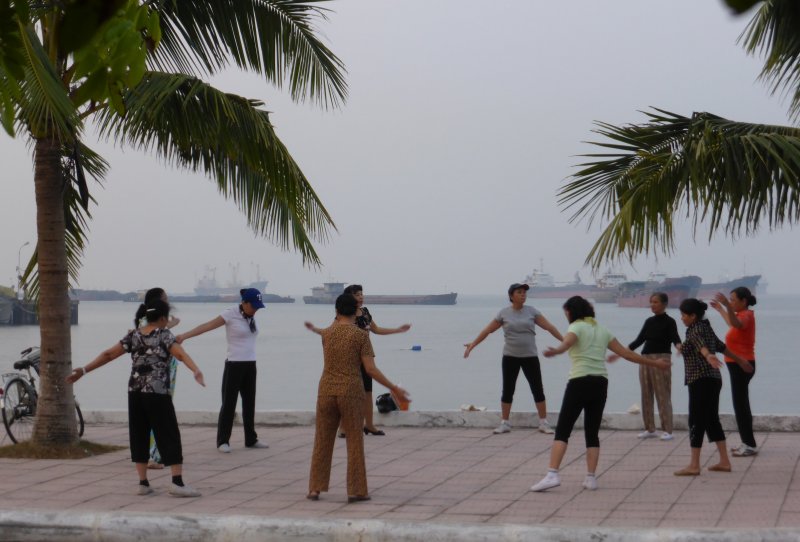Morning exercise by the seawall