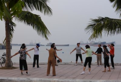 Morning exercise by the seawall