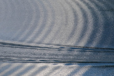 Intersecting boat wakes on Waterton Lake