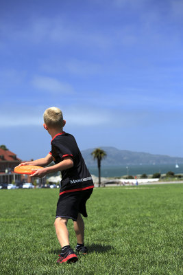 Boy Throwing Frisbee