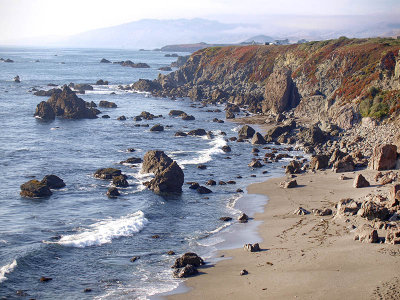 coast beach waves cliffs