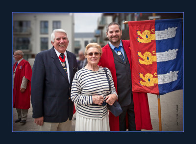 A veteran Beach Hut Owner poses beside two of the Officers