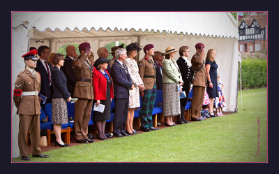 Dignitaries stand for the Drive and March Past