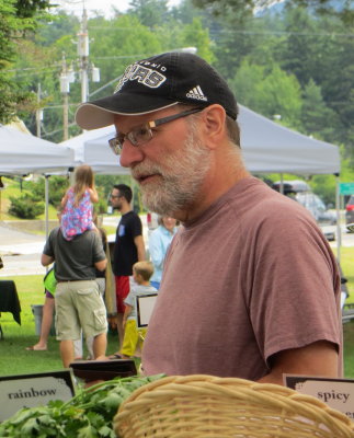 Looking over the goods at the Farmer's market