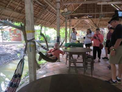 Hammocks everywhere in the cafes - Bernie trying out one