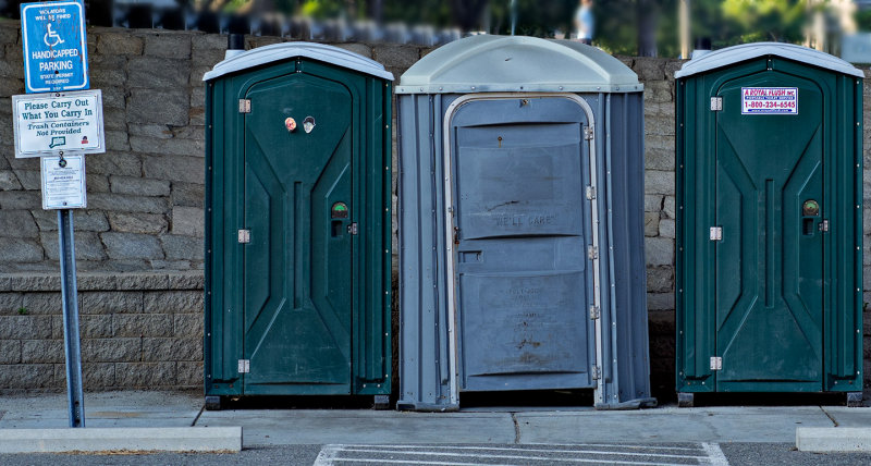 The middle sign on the left of these portable toilets makes me laugh. 