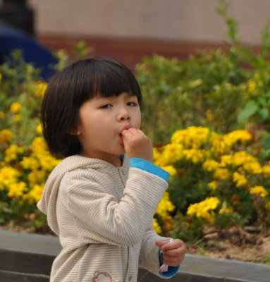 Little Miss Hong Kong snacking