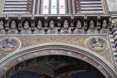 Cornice busts