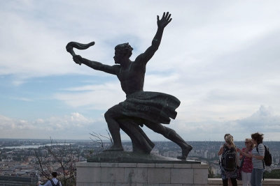 Statue at the base of the Liberty statue