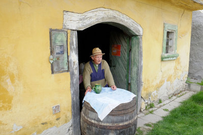 Owner of the old Madoros László cellar ready to serve his wine