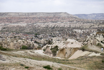 The town Göreme with rock houses in front of the spectacularly coloured valleys nearby