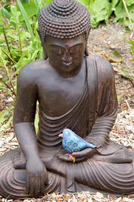 Seated Buddha with bird