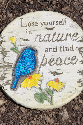Garden disk with aphorism