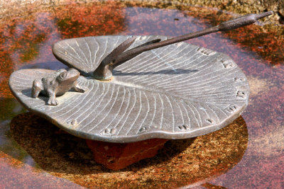 Bronze sundial and birdbath