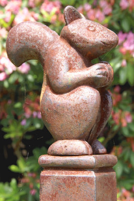 Squirrel, metal sculpture, between gardens