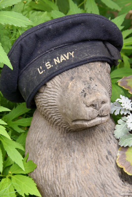 Bear wood sculpture with hat