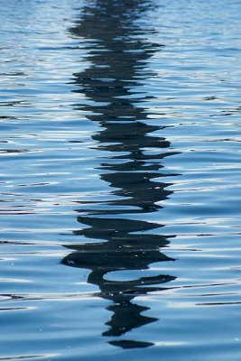 Reflection of lighthouse in the water.