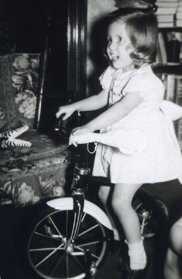 Julie Wiley with new tricycle at 405 South (1947).